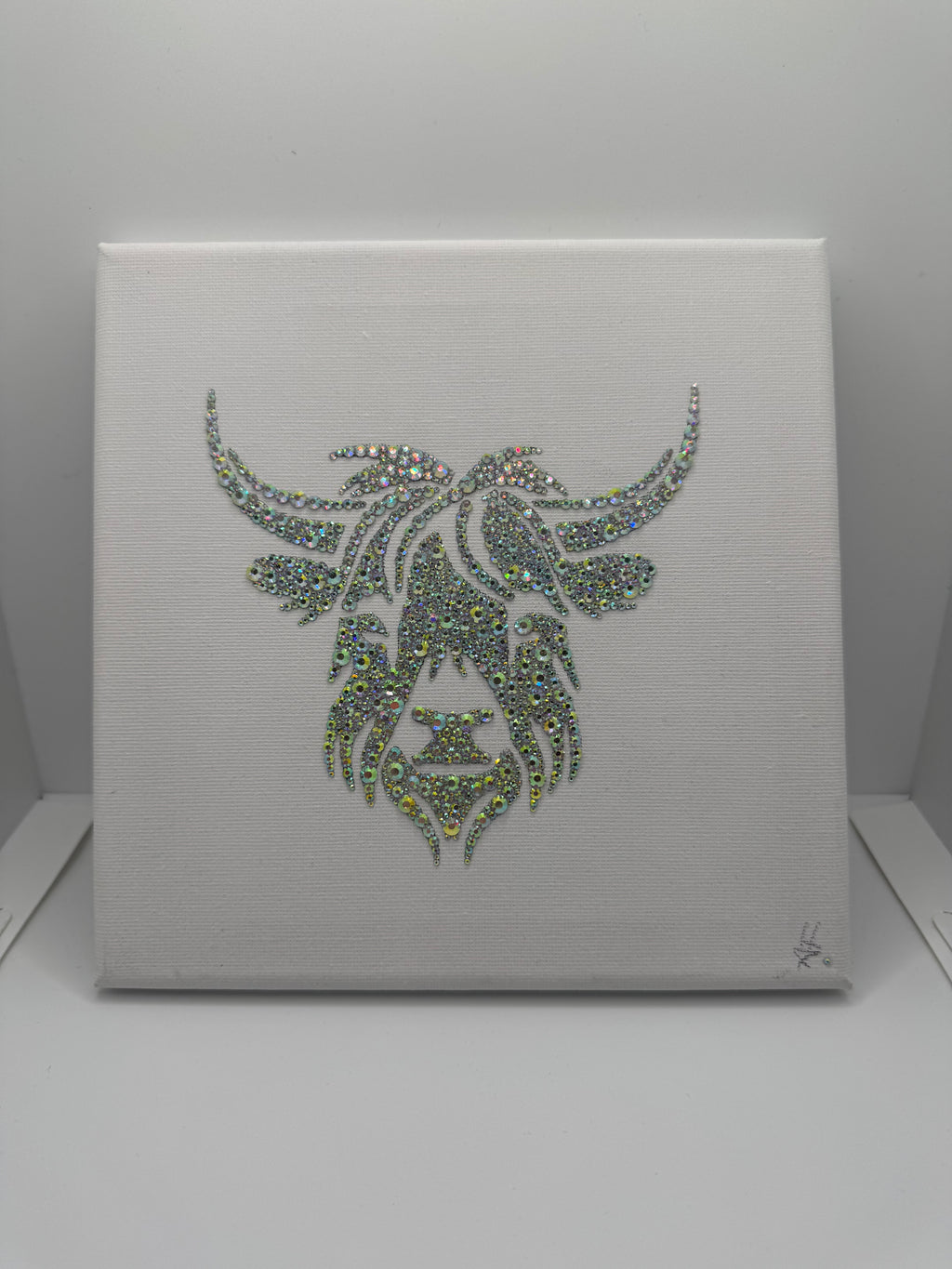 Bull design made in crystals on a white background