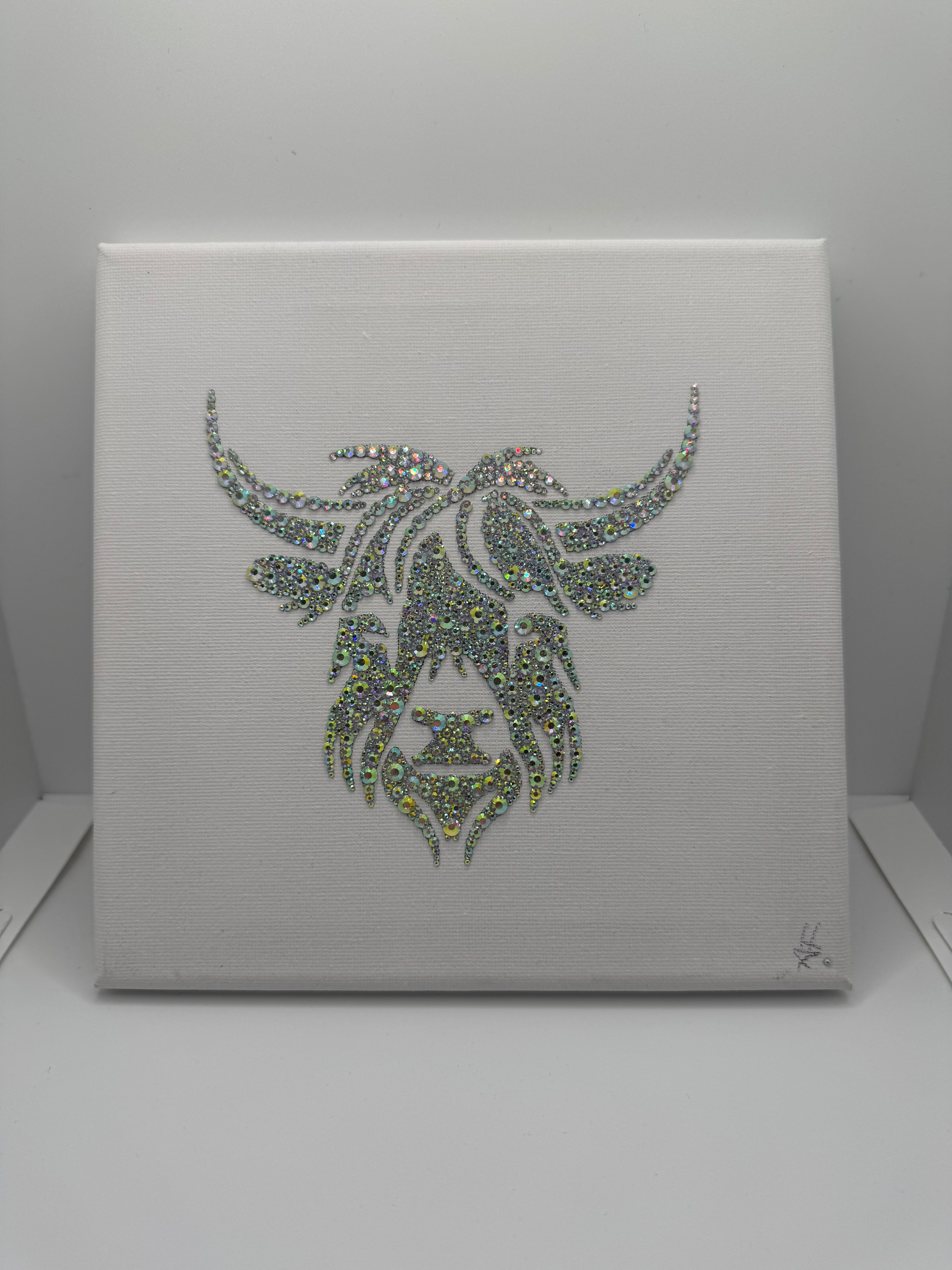 Bull design made in crystals on a white background