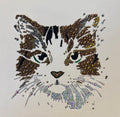 Cat face design made with rhinestones on a white background